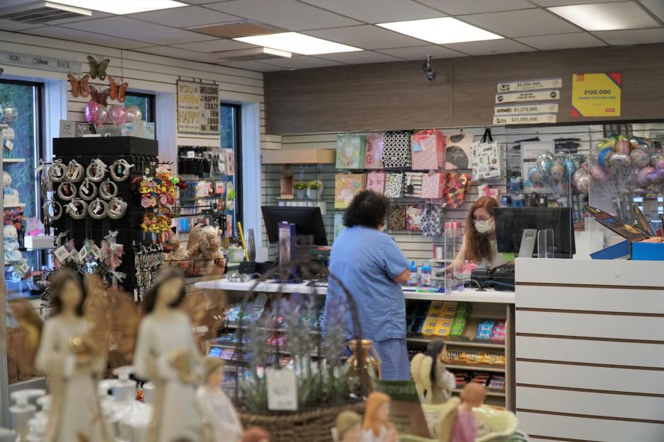 Volunteer Laura Reedel helps a customer at the General Store at MGH.