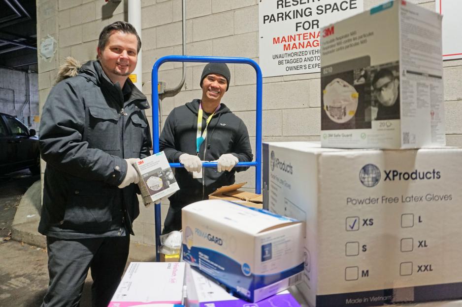 MGH staff receive mask donations from a community member as part of the PPE drive.