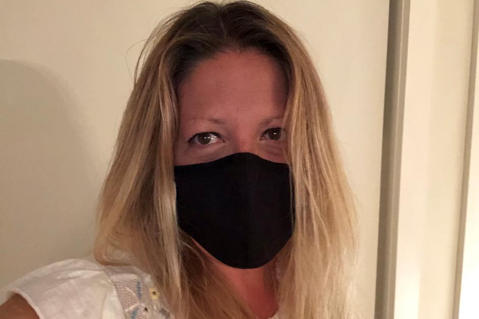 Mikki Hymus, principal of Grenoble Public School, wears a mask.