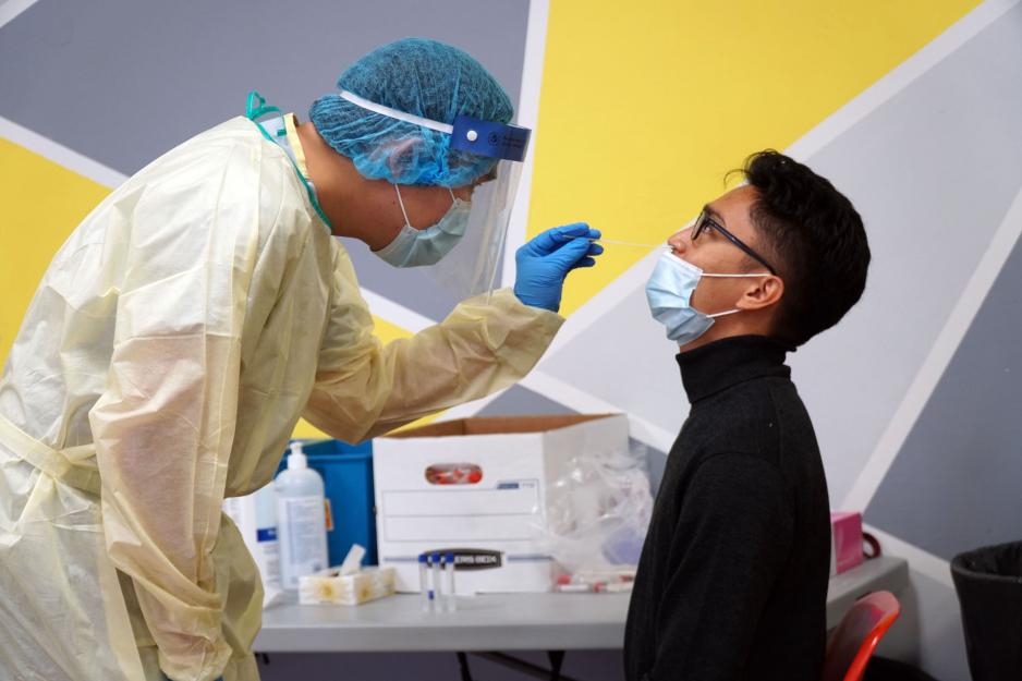 A man receives a COVID-19 test at one of a temporary testing site in Thorncliffe Park.