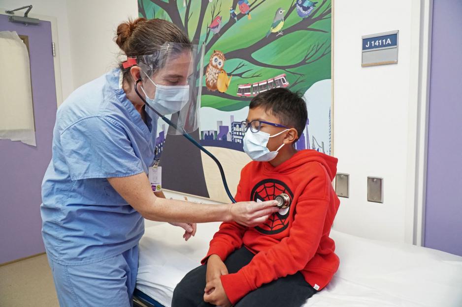 Dr. Angela Marrocco, Emergency Physician at MGH, examines a paediatric patient in the Child and Youth Emergency Zone.