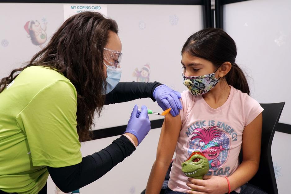 A child receives their COVID-19 vaccine.