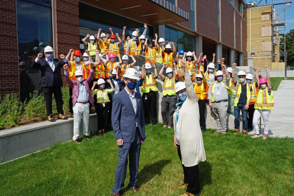 MGH Redevelopment team cheers after Sarah Downey receives the key to the Thomson Centre