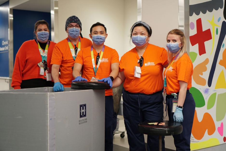 Staff standing wearing masks