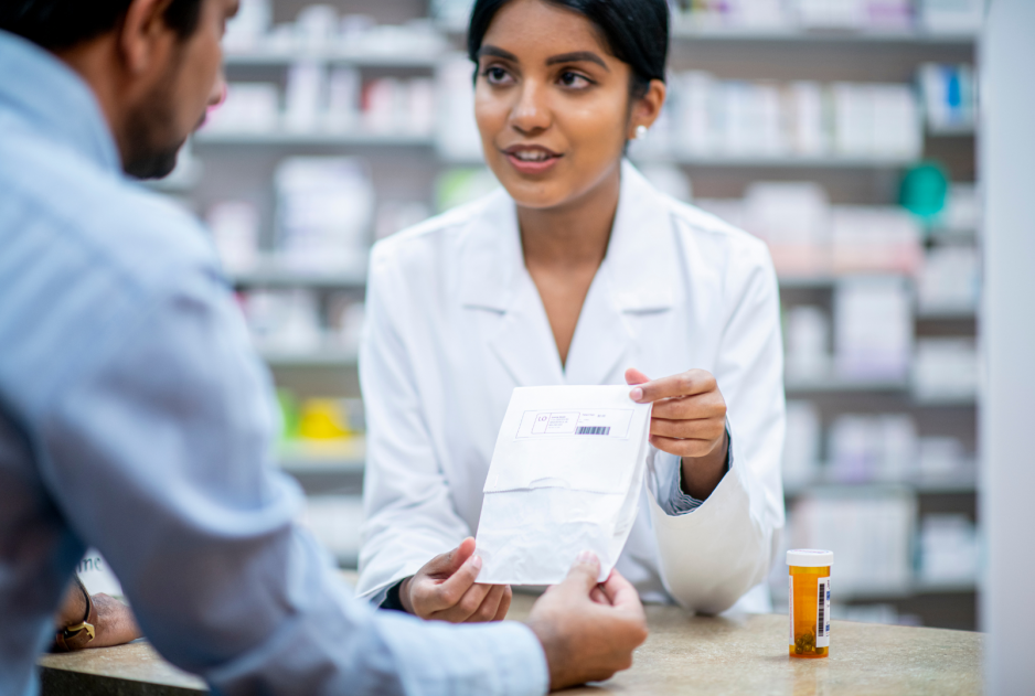 Pharmacist gives a client their prescription