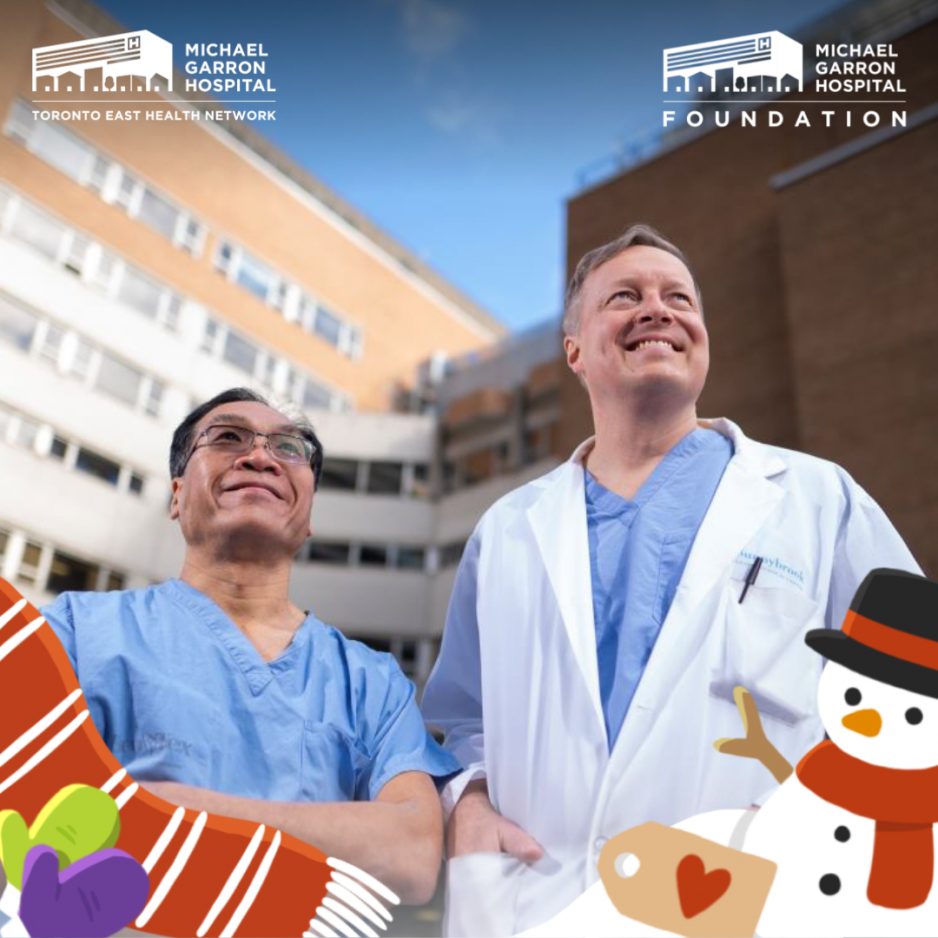 Two men in medical scrubs in front of a hospital, smiling and looking up into the sky.