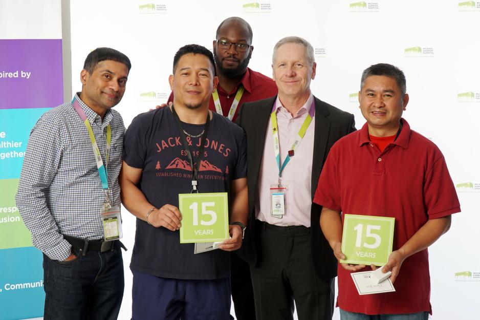 Frederick Manuyag and Christopher Balbalosa receive Long Service Awards. 