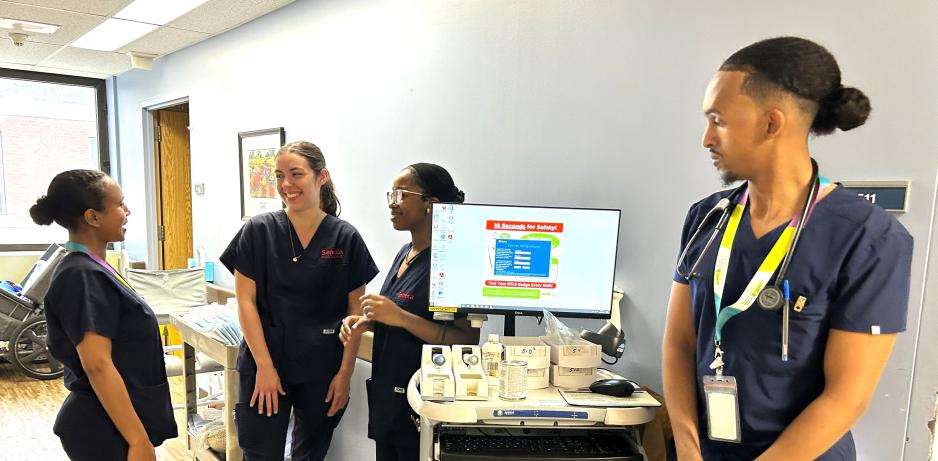 Four nursing students working on am inpatient unit at MGH