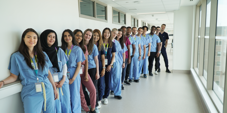 Group of resident physicians in a hallway.