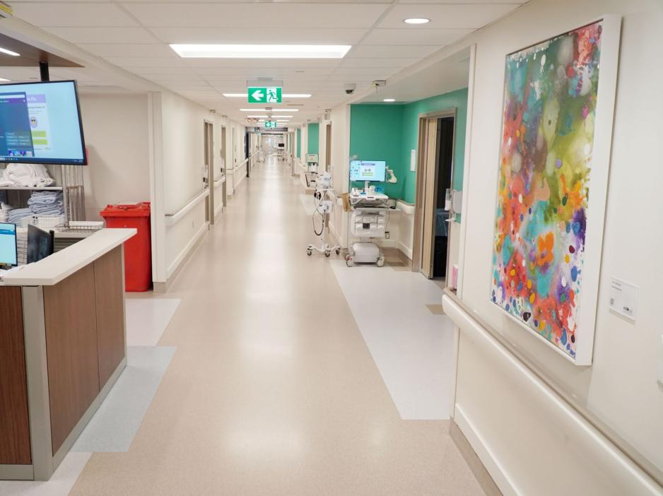 Bright and cheery team station and corridor in a hospital