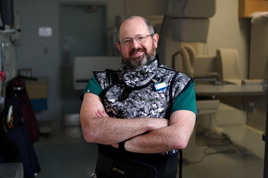 Dr. Ditkofsky stands in a clinical room with medical equipment